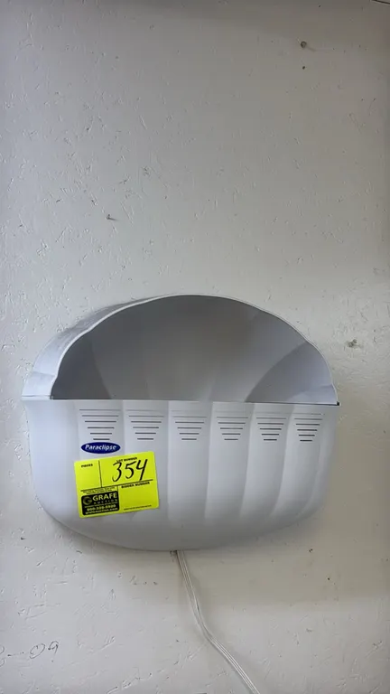 Paraclipse wall-mount insect trap light. Features white plastic decorative sconce housing with integrated power cord. 18"W.