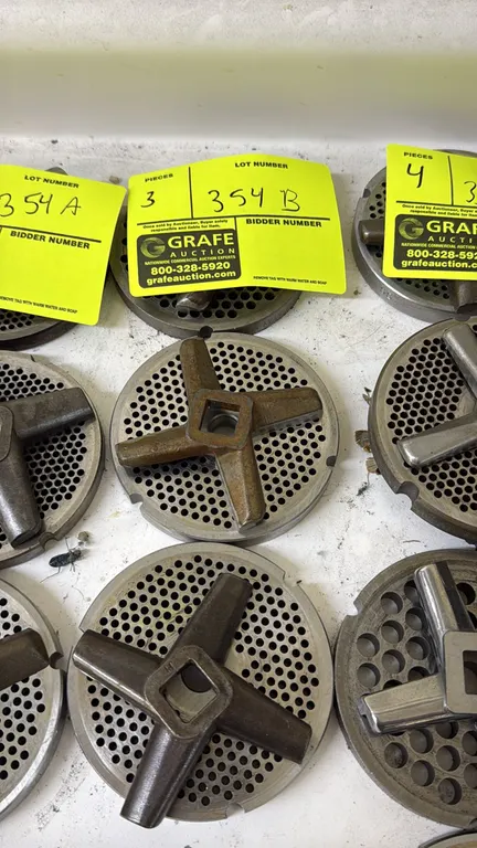 Meat grinder plates and cutting blades. Includes perforated grinder plates paired with 4-blade rotary cutting knives. 4"Dia.