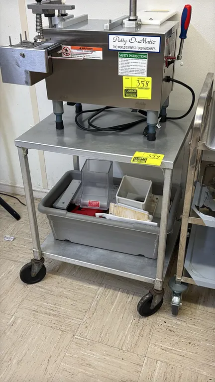 Stainless steel 2-tier utility cart. Features lower undershelf. 24". Mounted on casters. Note: Patty-O-Matic machine and lower shelf contents not incl