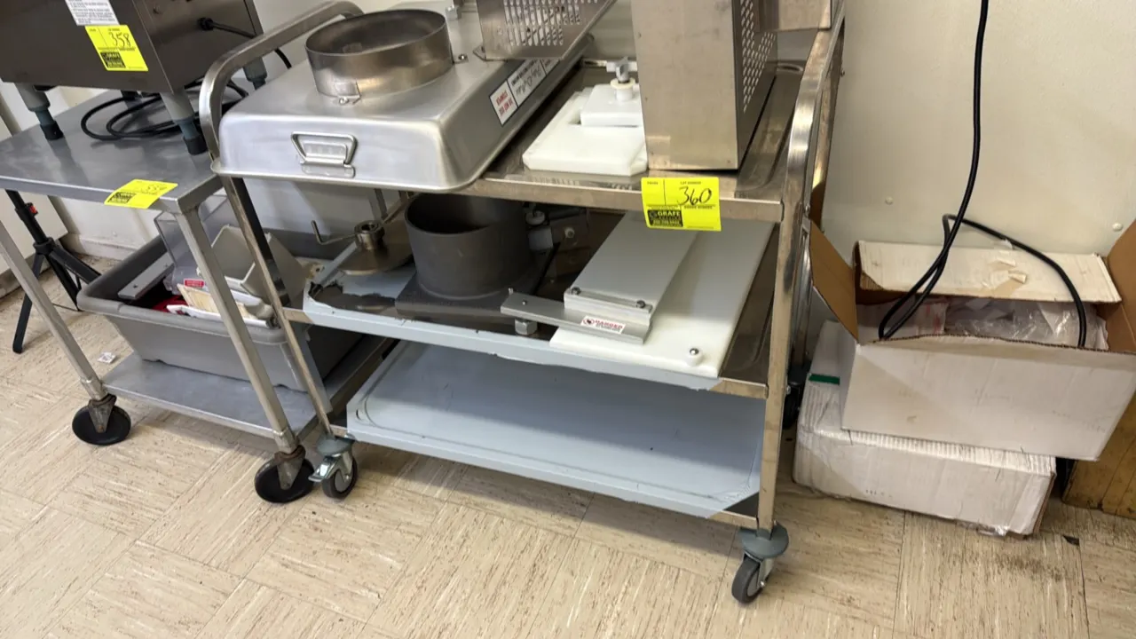 Stainless steel 3-tier utility cart. Features three solid shelves and integrated tubular push handles. 37". Mounted on swivel casters. Contents not in