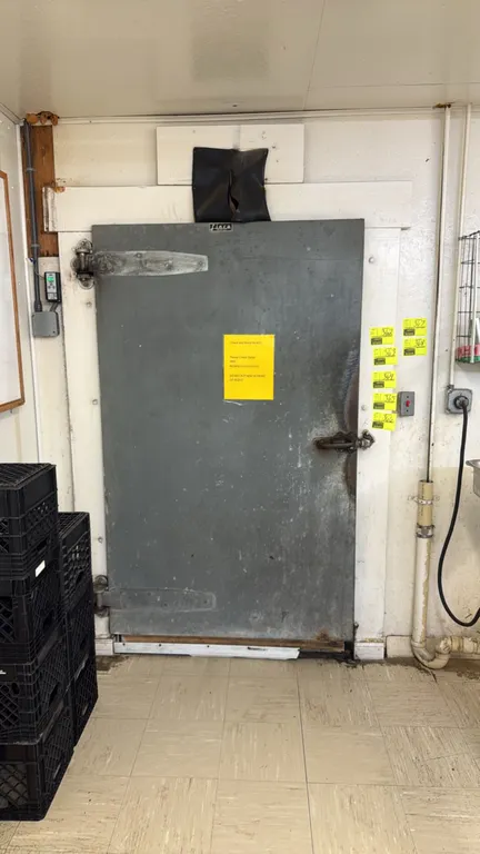 Walk-in cooler. Features hinged access door, 3-fan evaporator coil, and interior lighting. 16.5' x 9' x 8'. Shelving, racks, and contents not included