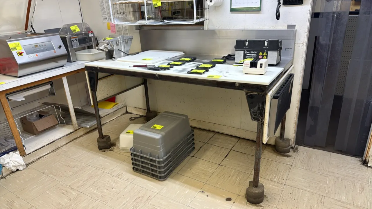 Poly top metal prep table. Features a stainless steel backsplash and side-mounted stainless steel knife rack. Dimensions: 72"L x 36"W. Contents and ta