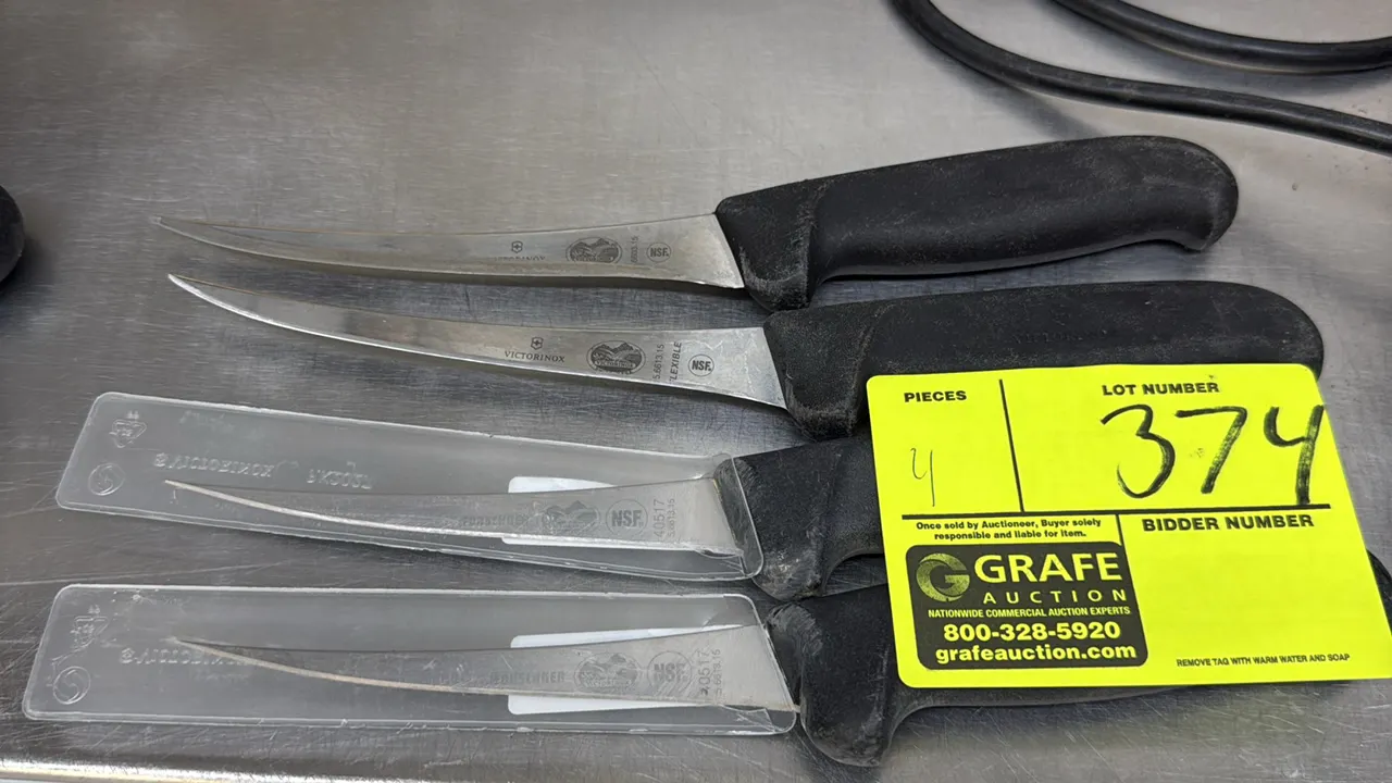 Victorinox curved boning knives. Features stainless steel blades, textured black non-slip handles, and plastic blade guards. NSF certified.
