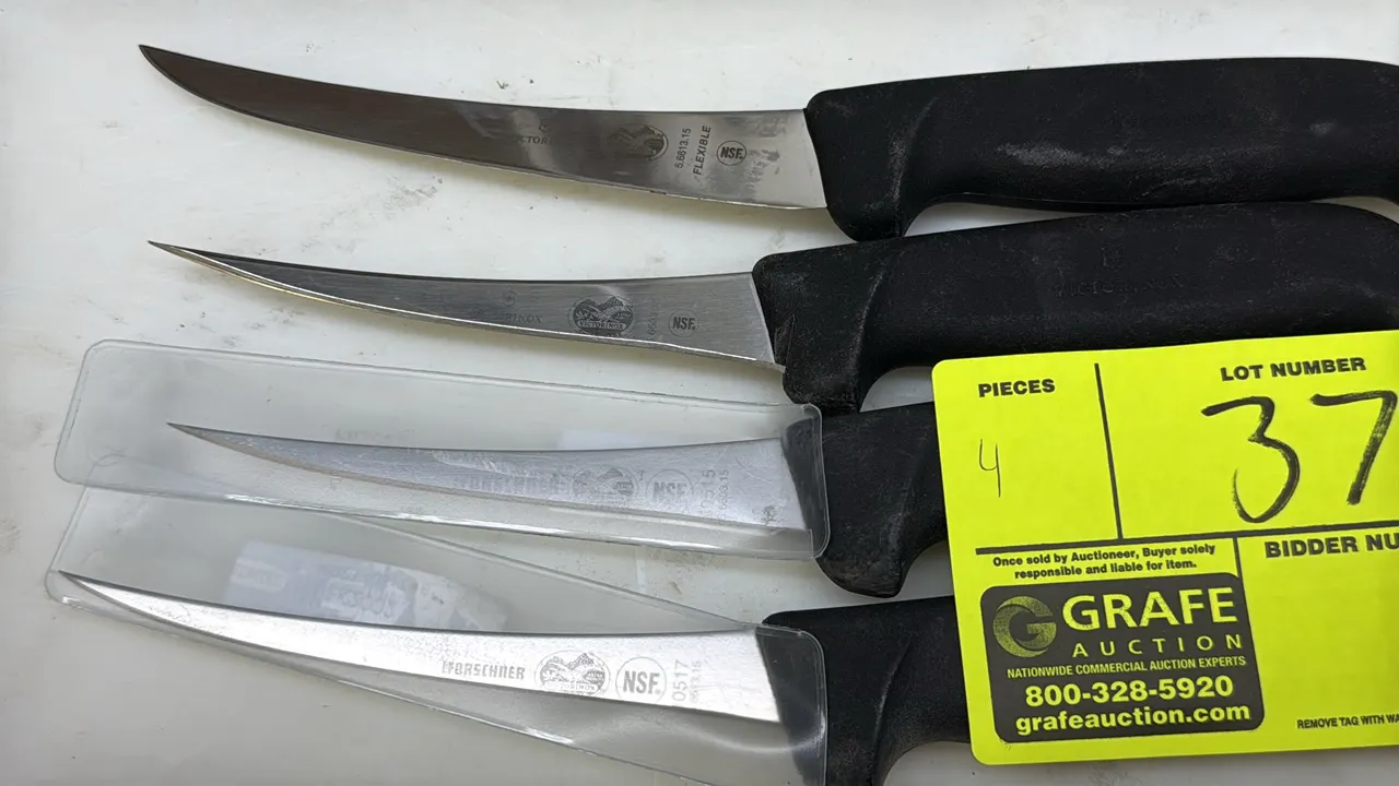 Victorinox Forschner curved boning knives. Features stainless steel blades, black non-slip handles, and NSF certification. Includes two plastic blade