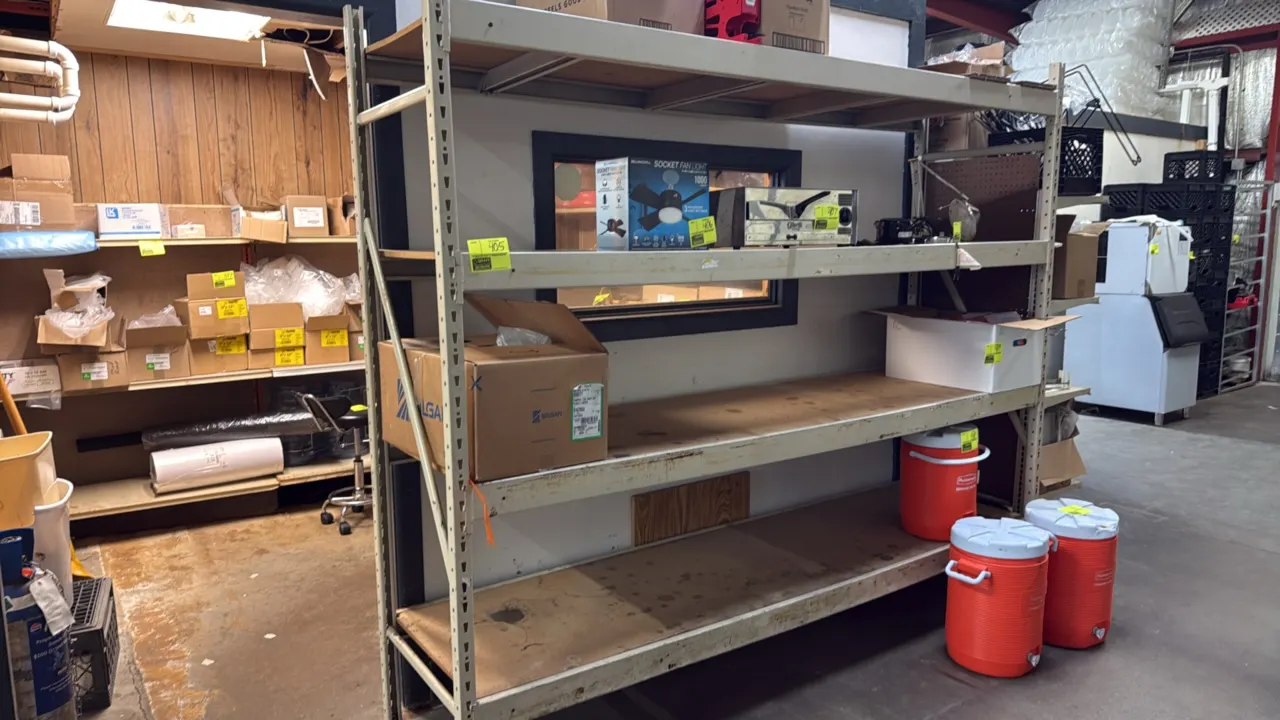 Light-duty warehouse storage racking. Features 4 shelf levels with wood decking and 3.5" cross beams. Dimensions: 100" x 26" x 84". Contents not inclu