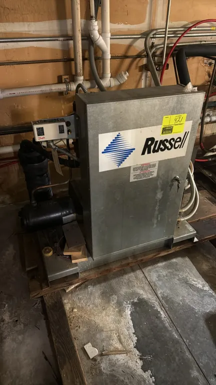 2008 Russell refrigeration compressor rack. Features a Copeland Scroll ZF18K4E-TF5-256 compressor, Danfoss pressure controls, liquid receiver tank, an