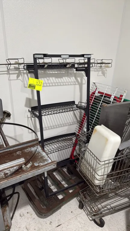 Package lot including a metal flatbed stock cart and a merchandise display rack. Display rack features a multi-tier black metal frame with wire shelve