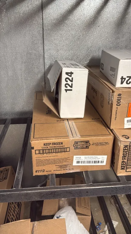 Assorted frozen food inventory. Includes packaged meats, poultry, seafood, pizzas, and prepared foods from brands such as Hunt Brothers Pizza, Tyson/I