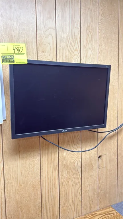 Acer 22" computer monitor. Features a widescreen display and black casing. Wall-mounted.