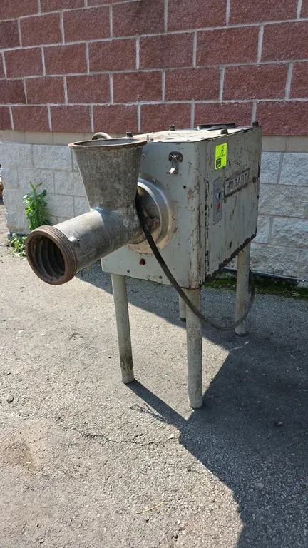 Hobart 4152 commercial meat grinder. Features push-button start/stop controls and 4-leg floor base. S/N: 11-176-390. Electrical: 208V, 60 Hz, 3-Phase,
