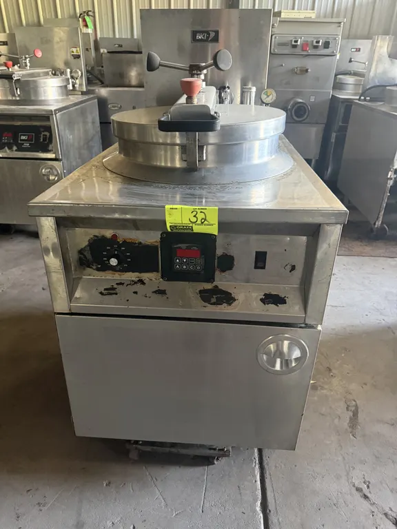 BKI FKM-F commercial electric pressure fryer. Features stainless steel construction, circular fry pot with wire basket, locking pressure lid, digital