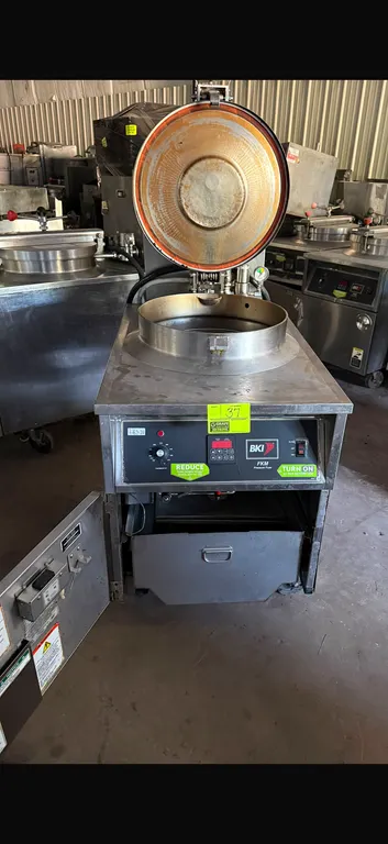 2008 BKI FKM-F electric pressure fryer. Features stainless steel construction, digital controls with analog thermostat, locking pressure lid, round wi