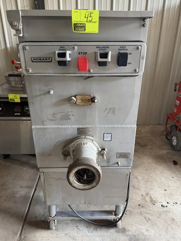 Hobart 4246HD meat mixer/grinder. Features stainless steel construction, mixing paddles, grinding auger, and push-button control panel with foot switc