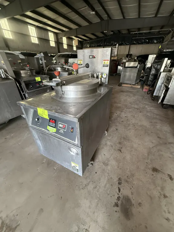 2008 BKI FKM-F commercial electric pressure fryer. Features round wire fry basket, locking hinged lid with pressure gauge, digital controls, and lower