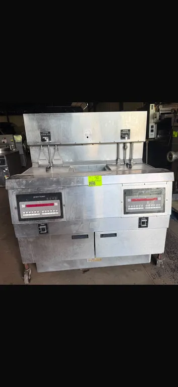 Henny Penny OEA-323 commercial electric open fryer. Features stainless steel construction, 2-well design, dual digital control interfaces, and lower f