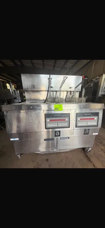 Henny Penny OEA-323 electric open fryer. Features stainless steel construction, digital programmable touchpad controls, and (4) wire fry baskets. S/N: