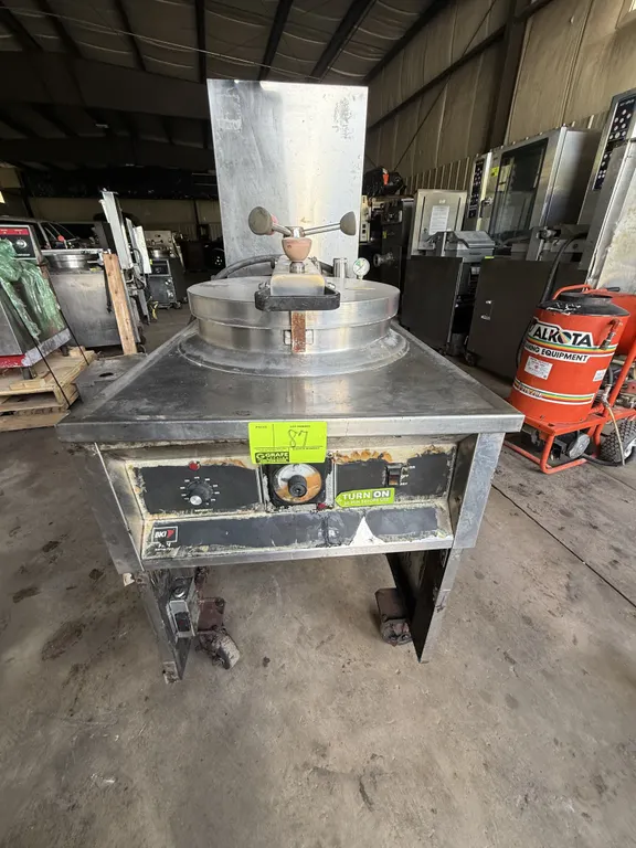BKI FKM-F electric pressure fryer. Features stainless steel construction, round locking pressure lid, front control panel, and stainless steel splash