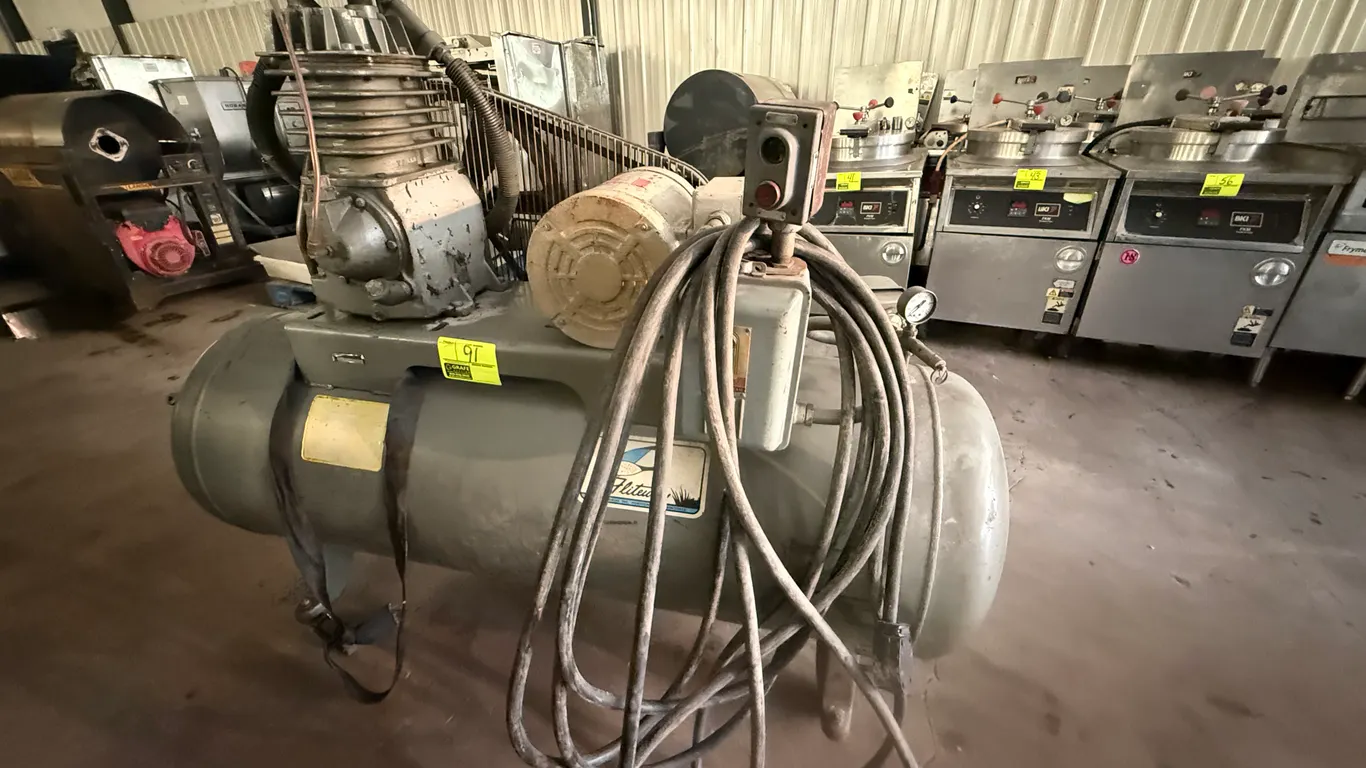 Fliteway horizontal air compressor. Features a 5 HP WEG electric motor, belt drive with wire safety cage, pressure switch, and horizontal air receiver