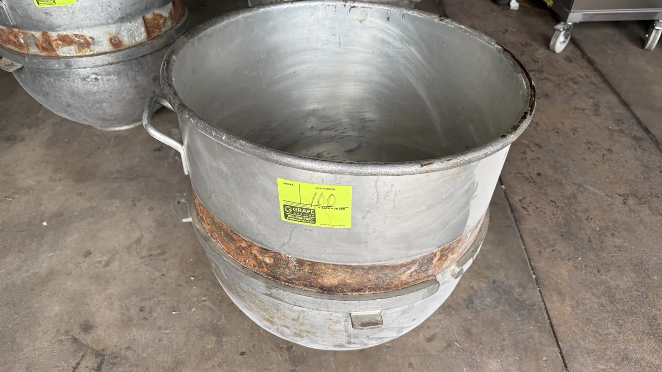 Hobart 140-quart mixer bowl. Features side lift handles and mounting brackets. Note: Heavy rust on outer mounting ring.