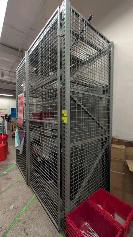 8'L section of Madix metal teardrop pallet racking security cage. Features 3.5" crossbars, wire mesh decking, wire mesh security panels, and double wi