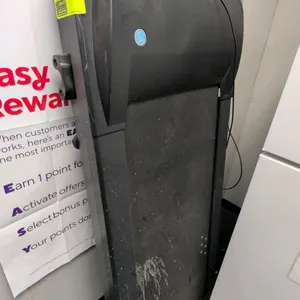 LifeSpan under-desk walking treadmill. Features a compact flat walking deck, front transport wheels, and a wired digital desktop control console.