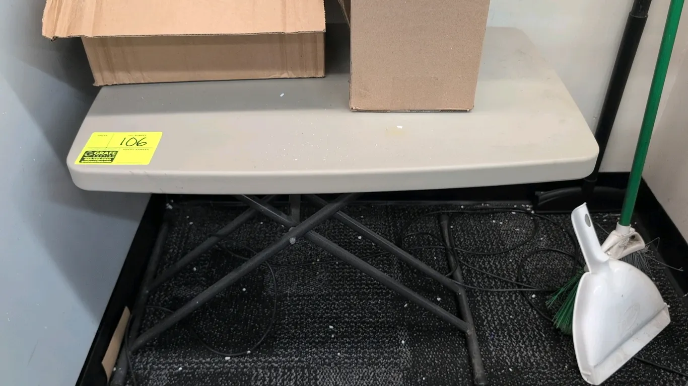 Poly folding table. Features a molded polyethylene top. Mounted on a foldable metal X-frame base. Dimensions: 30" x 21"H. Boxes not included.