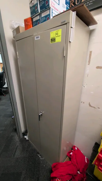 Sandusky metal 2-door storage cabinet. Features 3 interior shelves and locking latch handle. 30" x 15" x 72". Contents not included.