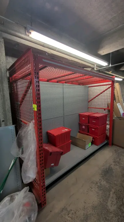 8' section of Madix metal teardrop pallet racking. Features 3.5" crossbars, wire decking, wire mesh panels, and pegboard backing. Dimensions: 4'W x 7'