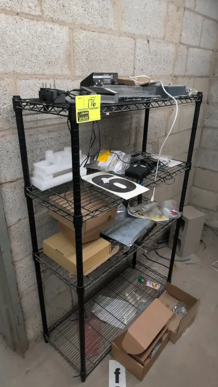 Metal 4-tier wire shelving rack. Features a black finish and adjustable wire shelves. 3'L x 1'W x 4.5'H. Contents not included.