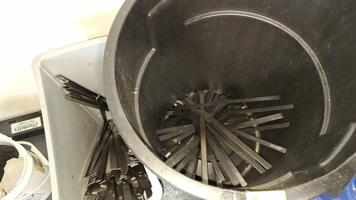 Assorted Metal Skewers, 2 Trash Cans