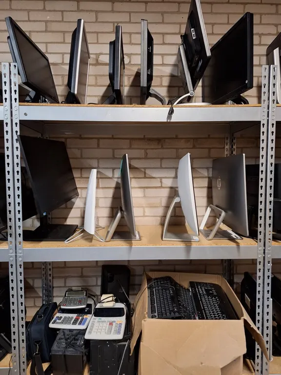 Assorted Computer Components on Shelves, Monitors, Printers and More