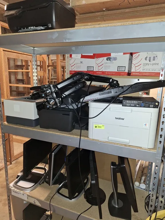 Assorted Computer Components on Shelves, Monitors, Printers and More