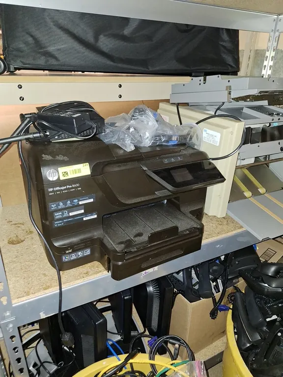 Assorted Computer Components on Shelves, Monitors, Printers and More