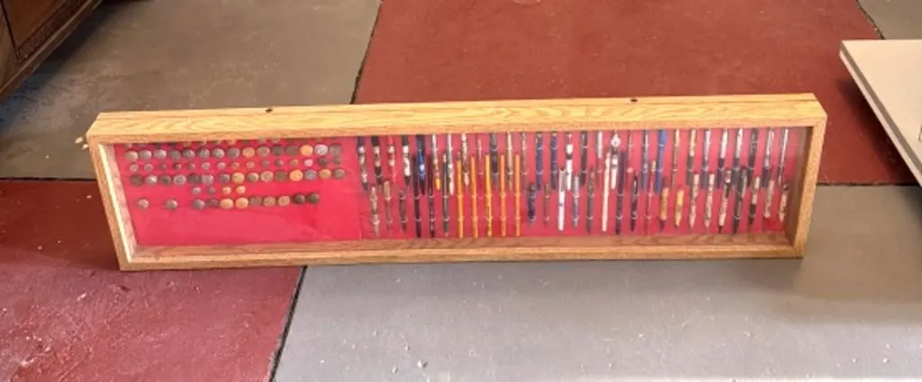 Uniform Buttons and Pens In Display Case