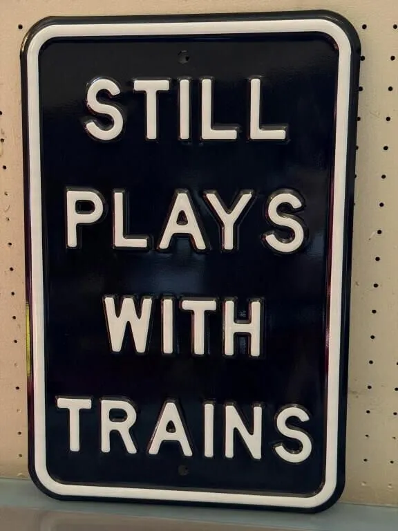 Still Plays with Trains Metal Sign 12” x 18”