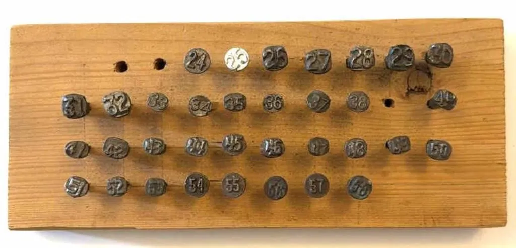 Railroad Date Nails in Wood Board
- board is
