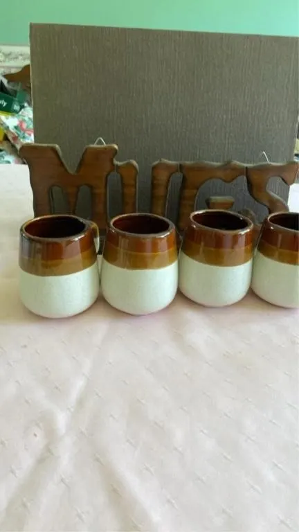 Mugs and sign