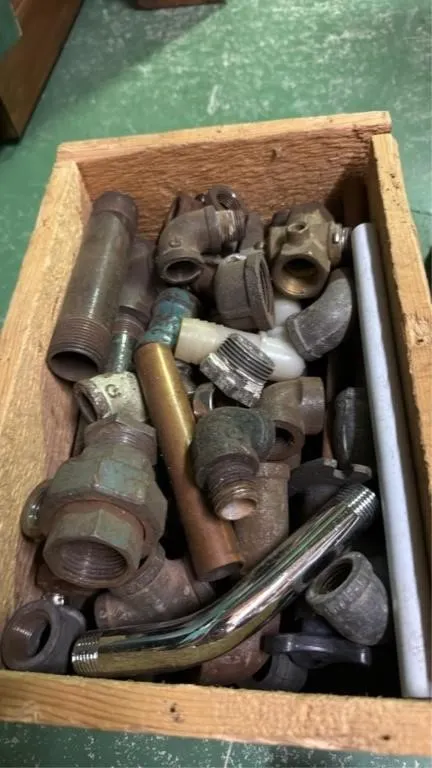 Assorted plumbing parts and door hinges