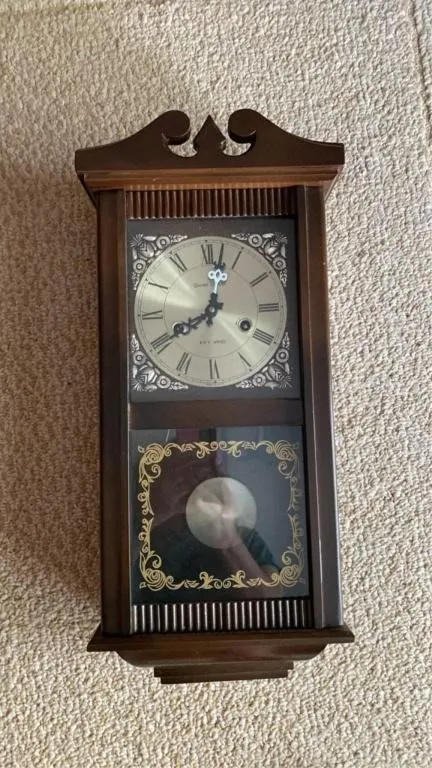 Wall clock with pendulum