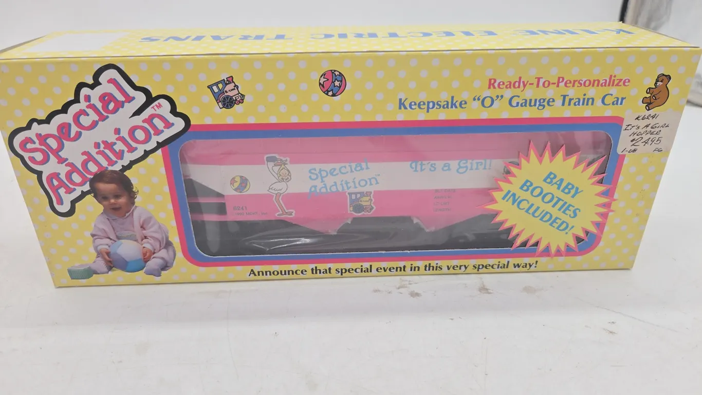 Vintage K-line, it's a girl special. Edition box car in original box.