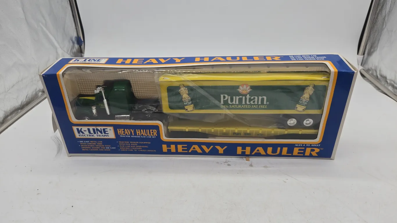 Vintage K-line, heavy hallers puritan tractor-trailer flat car set new inbox.