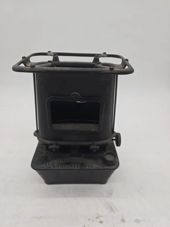 Antique number one, AJ lindman and hoversons company portable Sad iron Heater.