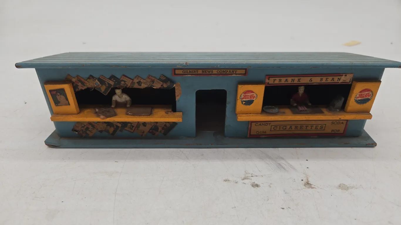 Vintage American flyer, number 270, the Gilbert news company, and hot dog stand
