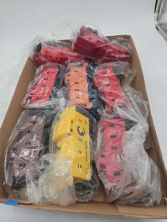 Large assortment of vintage train cars, all cabooses