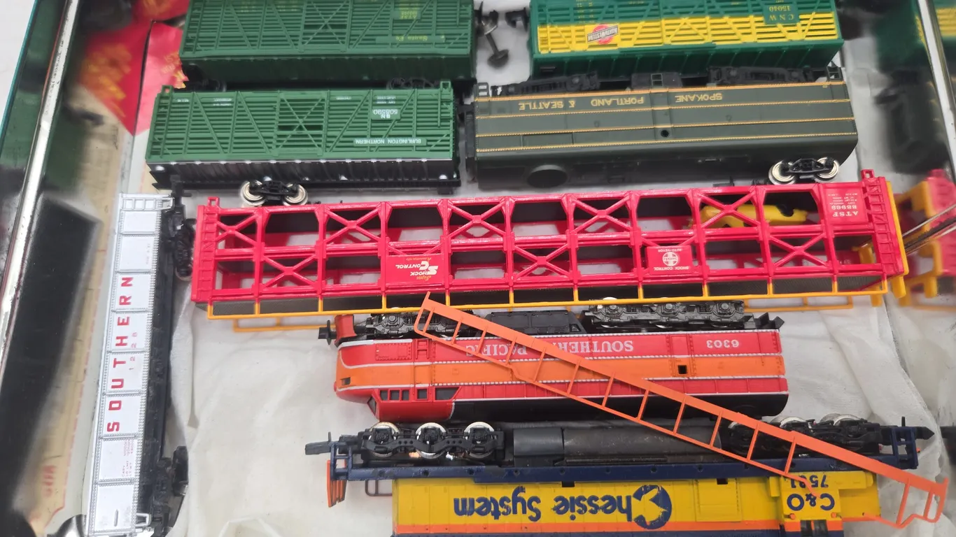 Assorted n scale locomotives and train cars.