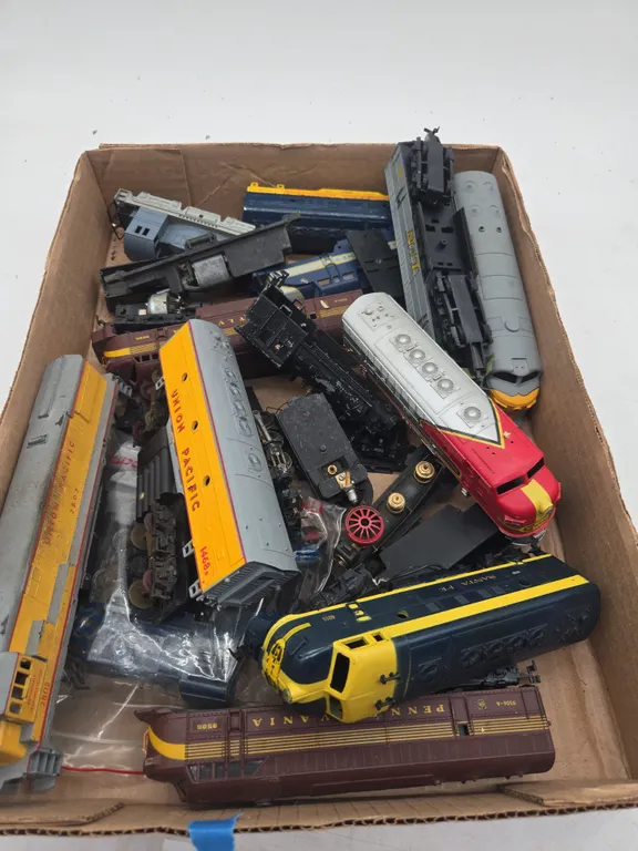 Large assortment of train pieces and parts