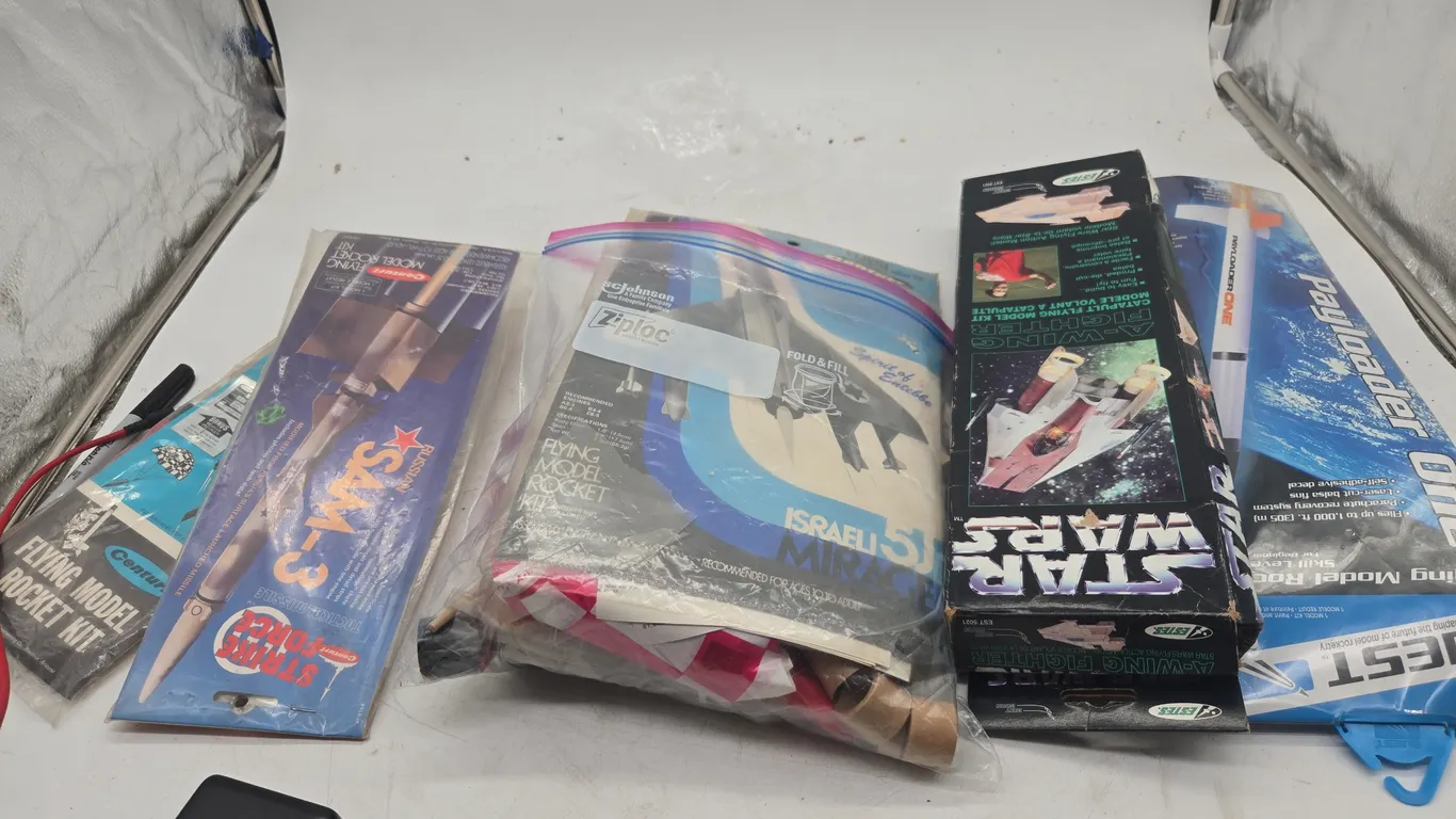 Assorted vintage flying rocket kits, new in packages
