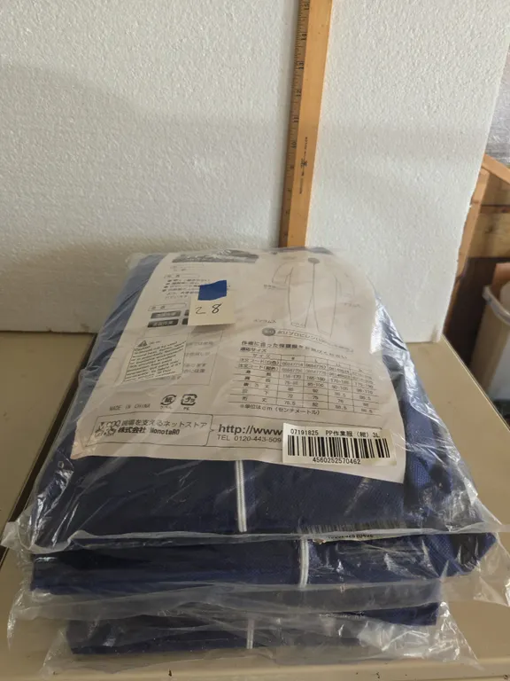 Tyvek style protective coveralls, new in packages