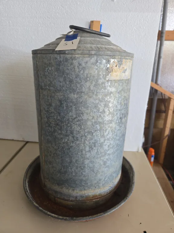 Vintage five gallon galvanized chicken watering can
