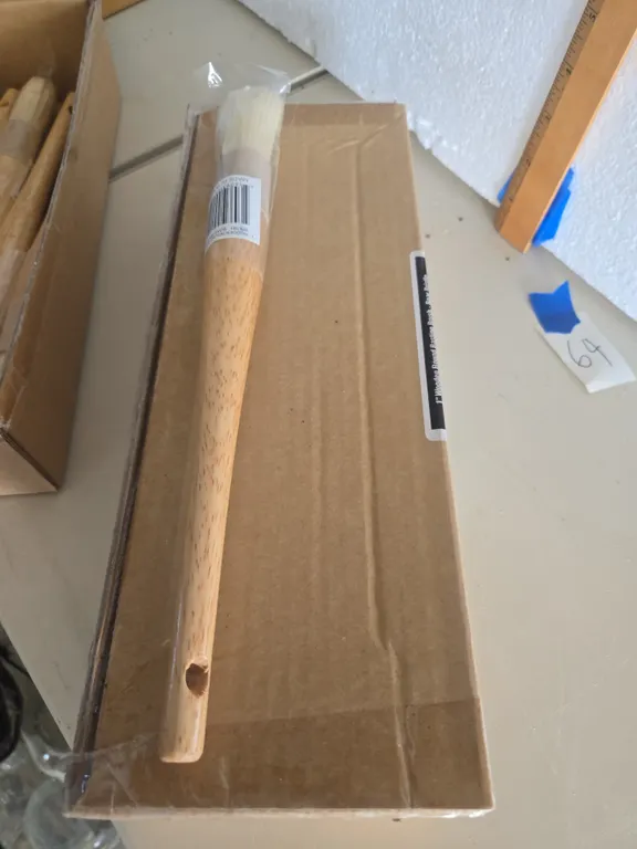 One dozen, one inch wooden round basting brushes, new inbox.